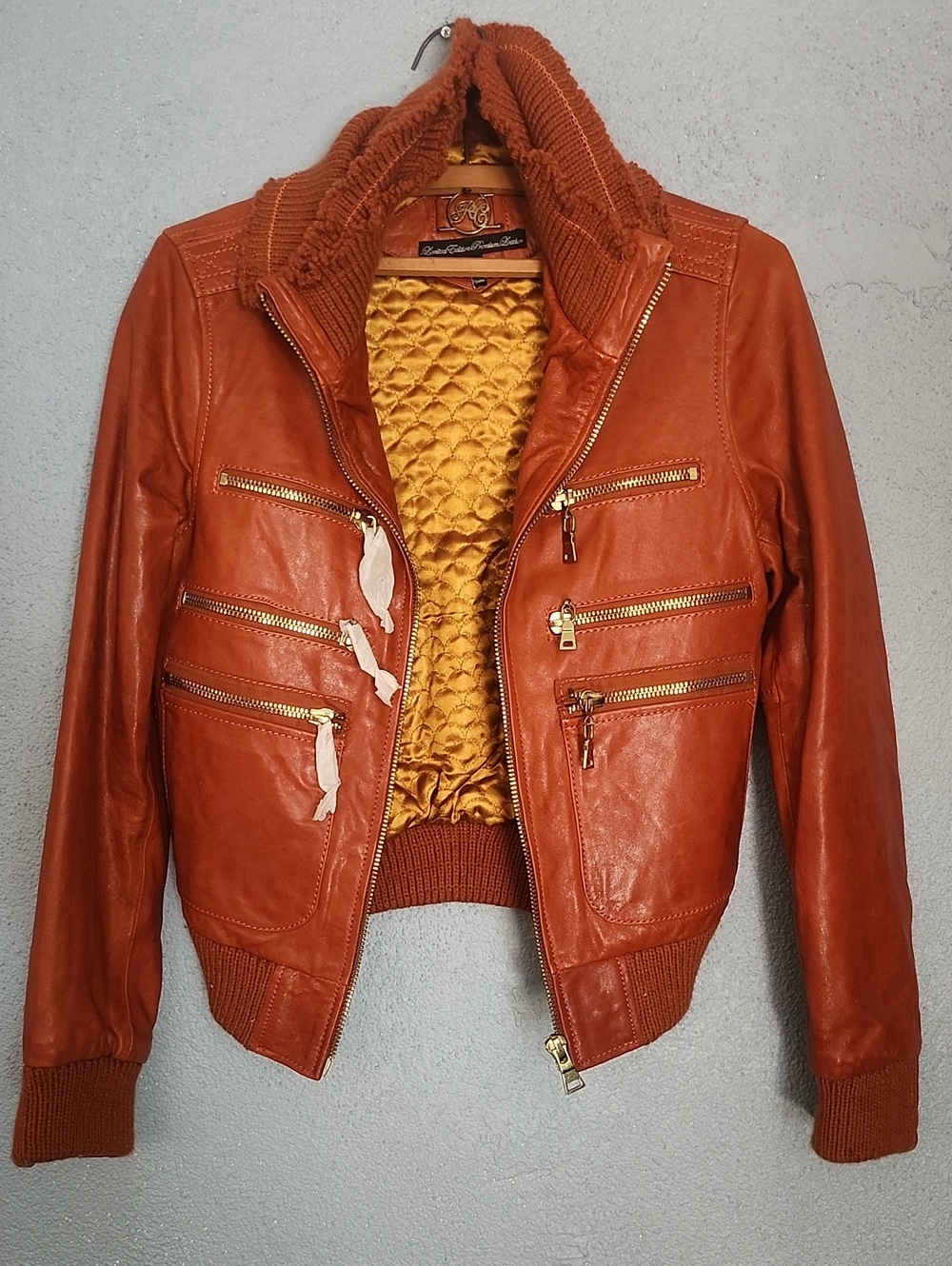 Women's Rust Orange Leather Bomber Jacket with Quilted Gold Lining